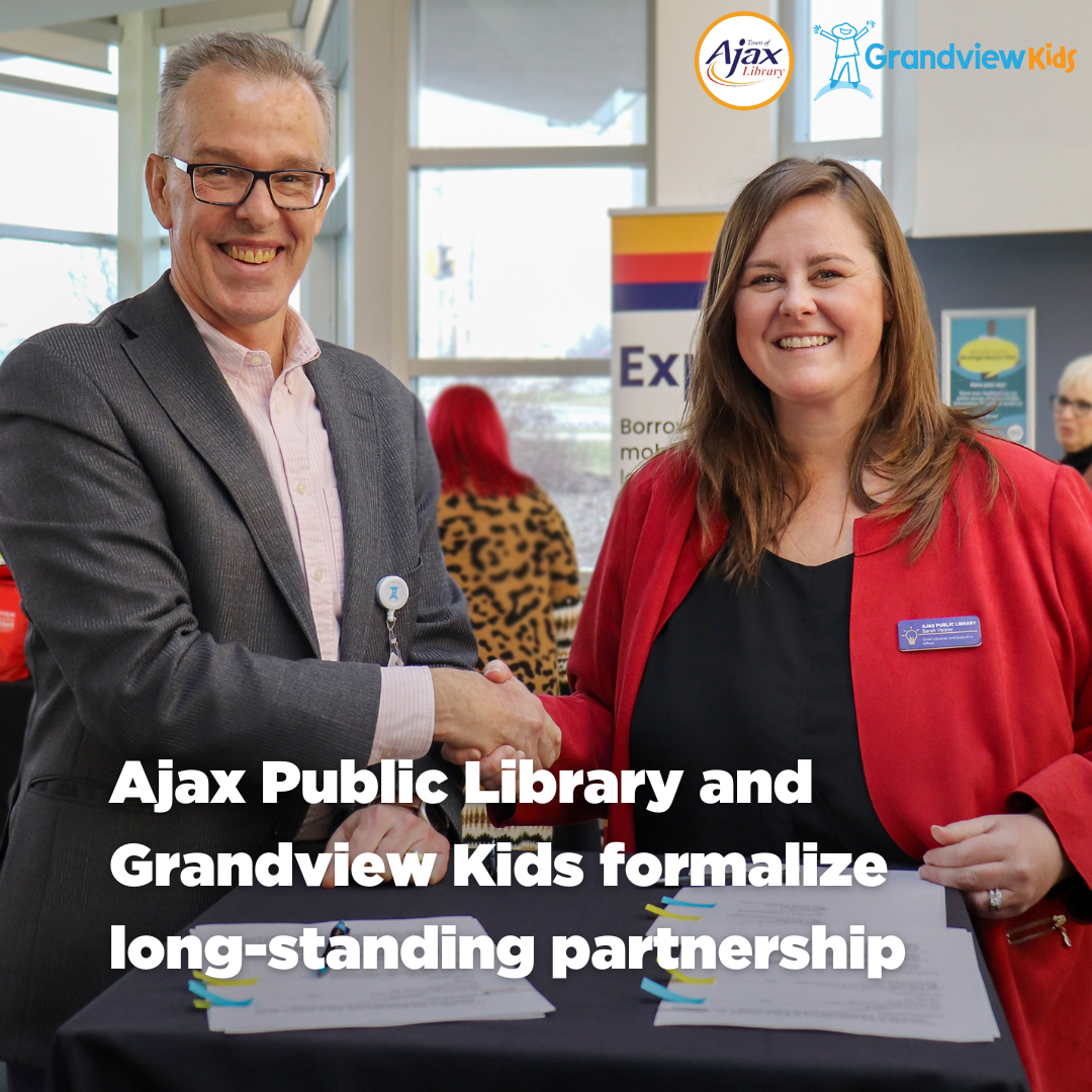 Chief Librarian and Executive Officer of Ajax Public Library, Sarah Vaisler, and Grandview Kids CEO, Tom McHugh, shaking hands.