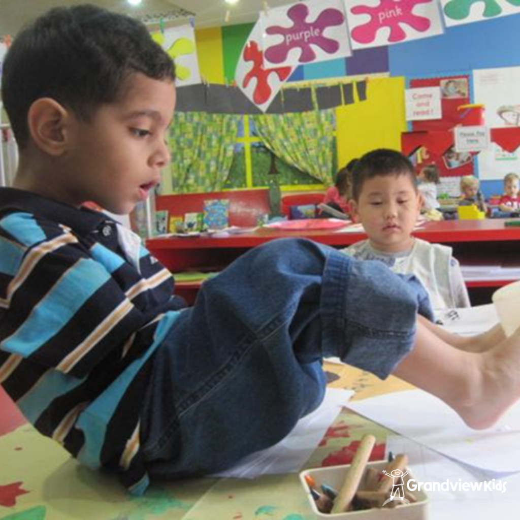 Shayaan as a child in a painting/colouring class.