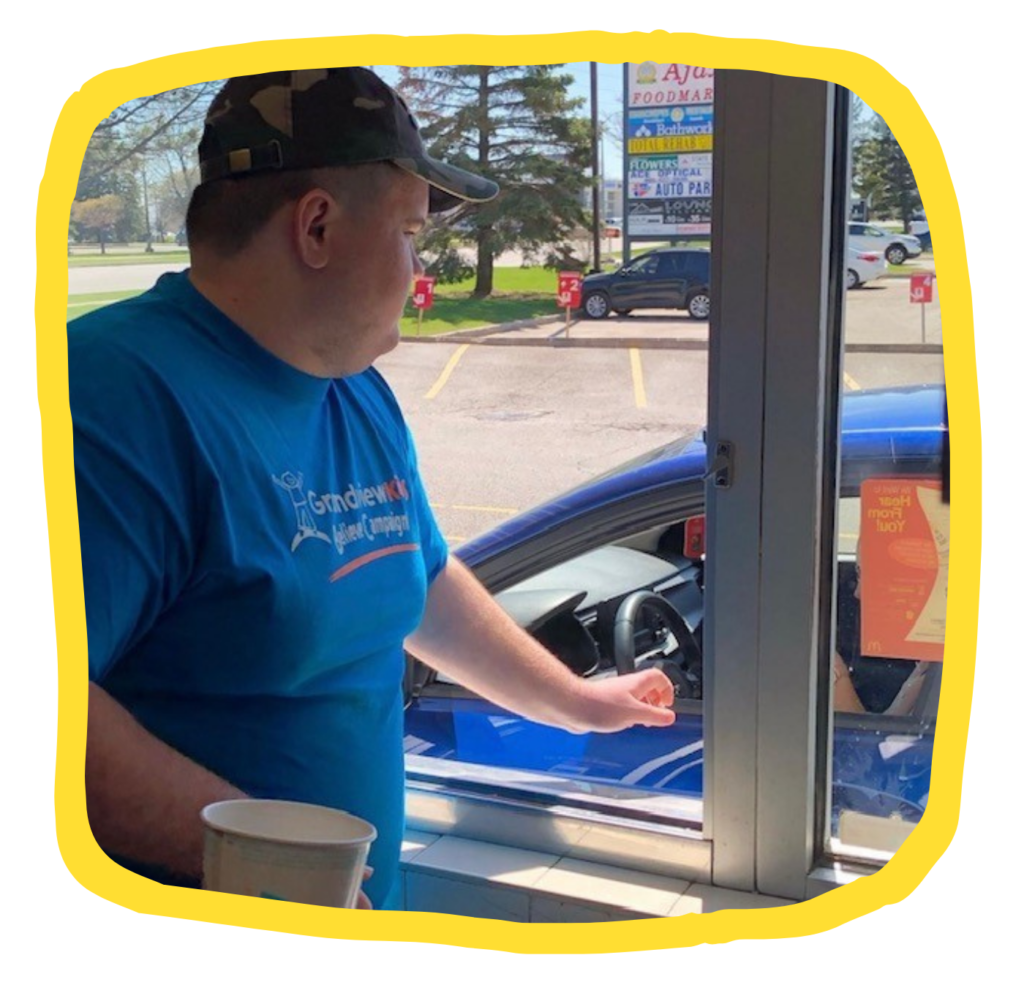 A photo of Elliot Smith working at a McDonald's Drive Thru on McHappy Day.