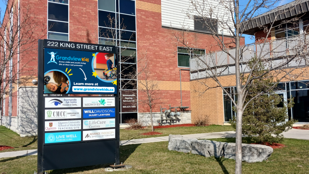 The front of the Bowmanville Health Centre showcasing Grandview Kids' banner on the advertising board.