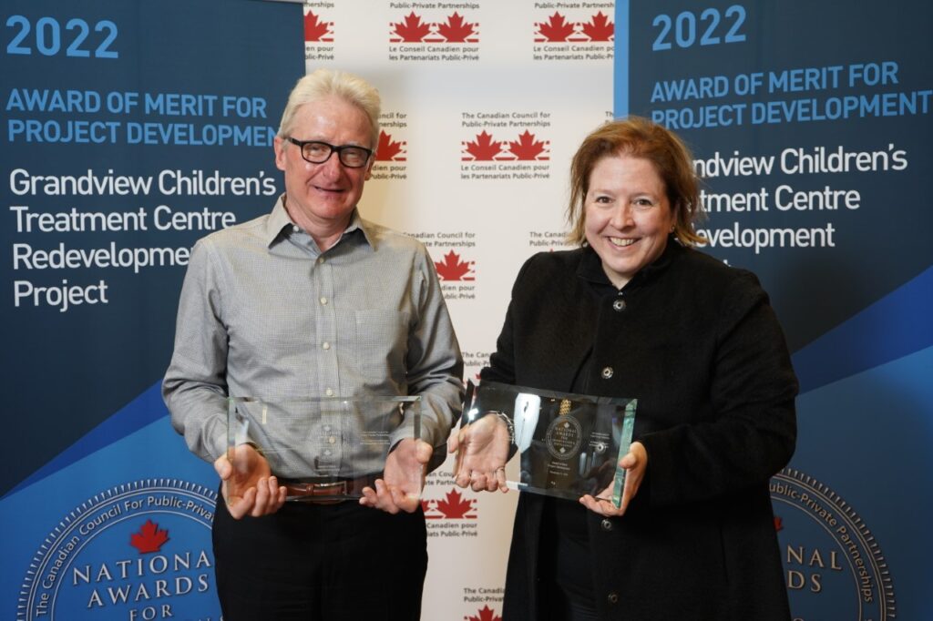 Grandview Kids Chief Finance Officer, Harry (left), accepting the Award of Merit for Project Development for the Grandview Children's Treatment Centre Redevelopment Project.