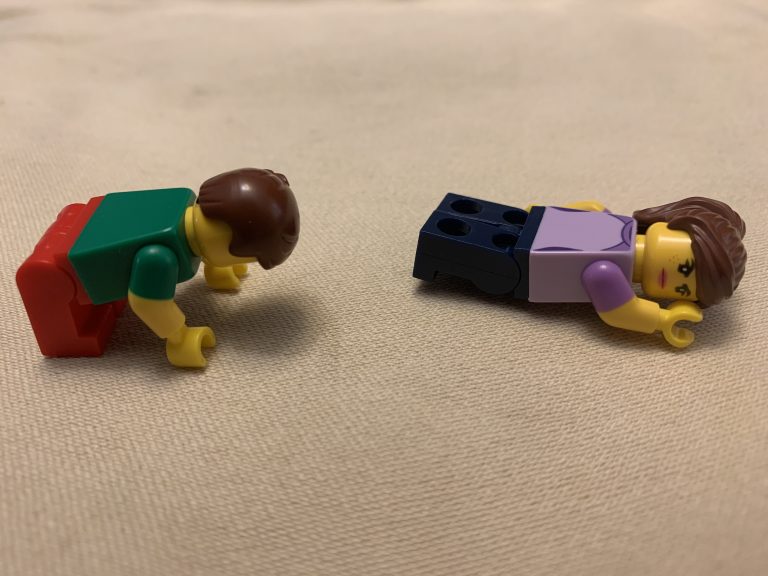 Small lego people doing exercises.