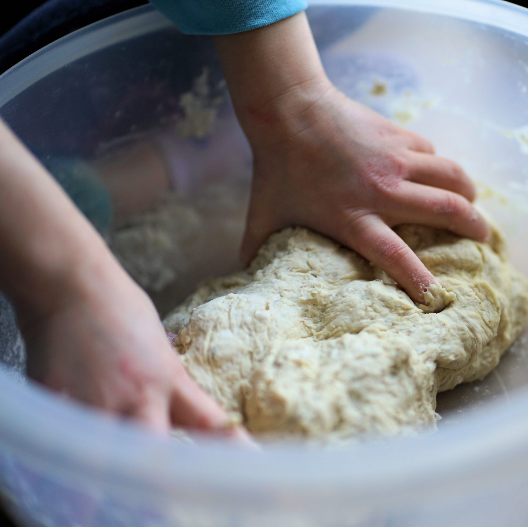 Kid kneading dough