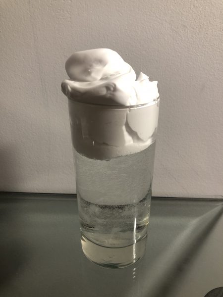 "Rain cloud" is overflowing from the top of the glass.