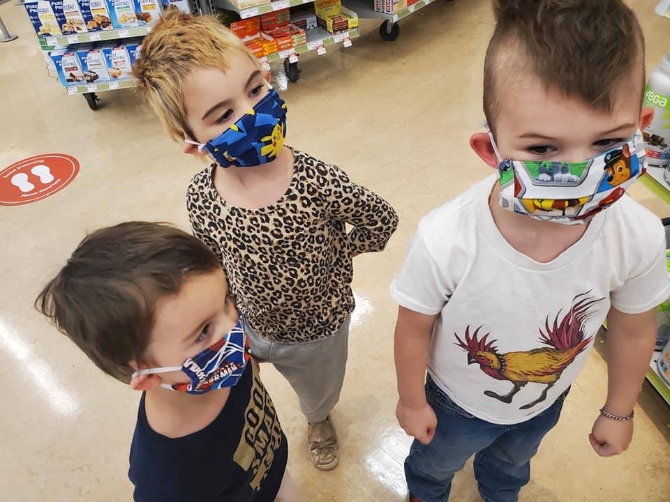 A group of children wearing face masks.