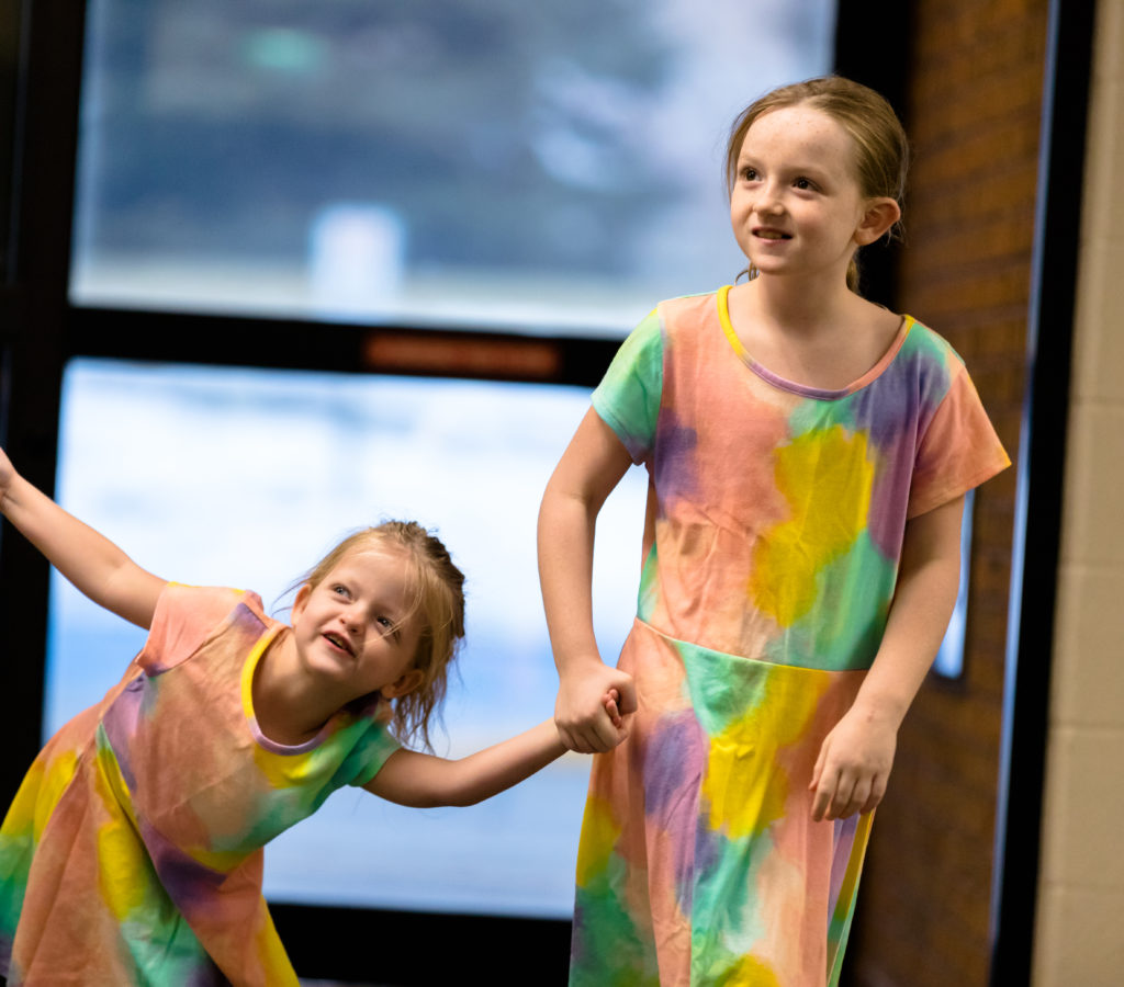 Sisters Teagan and Logan holding hands