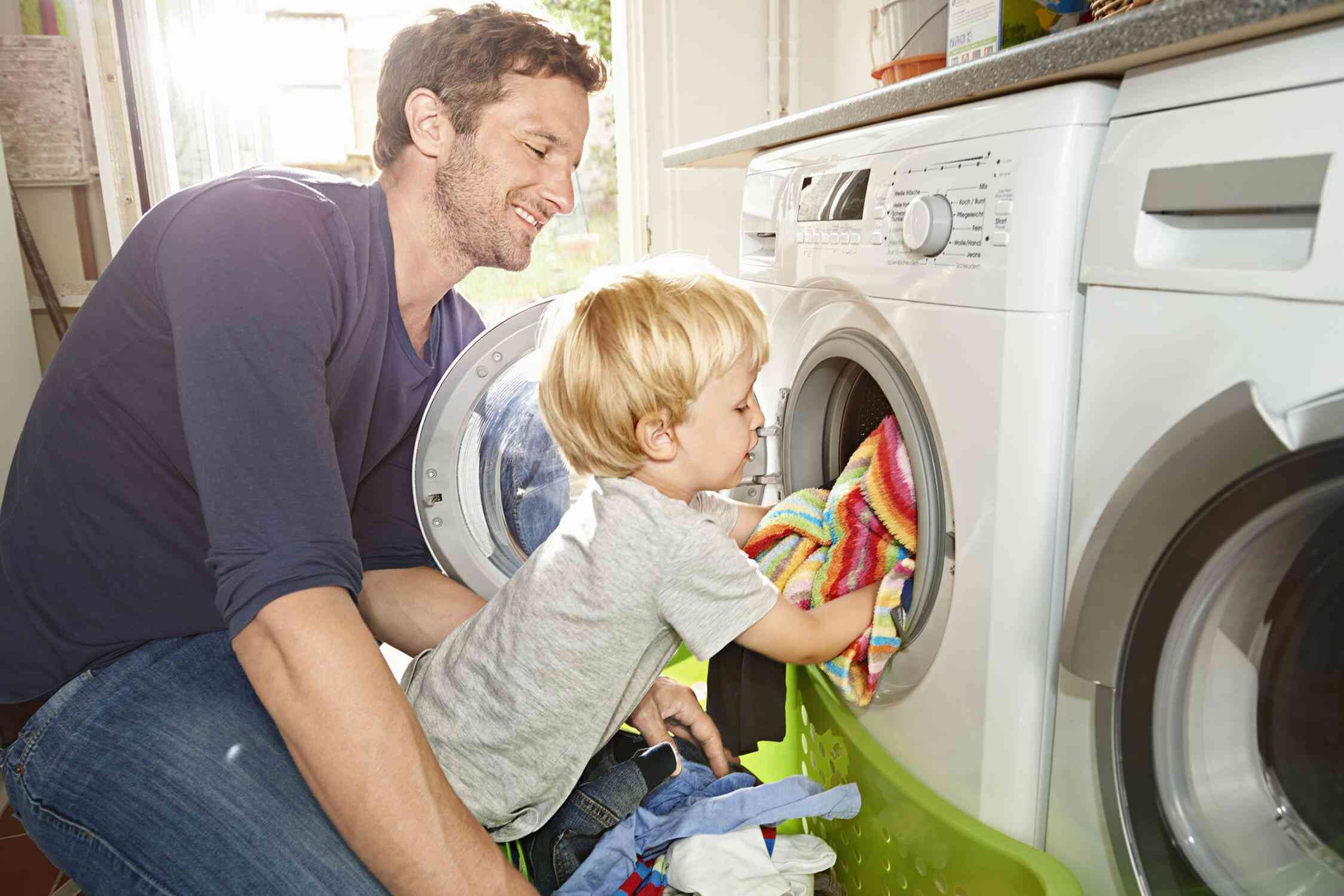 Father and child doing laundry
