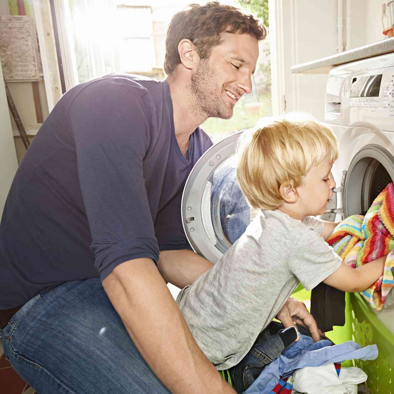 Father and child doing laundry