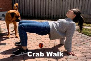 Woman acting out a crab walk motion.