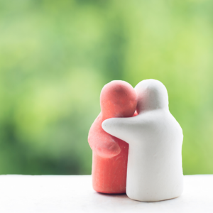 Clay figures hugging