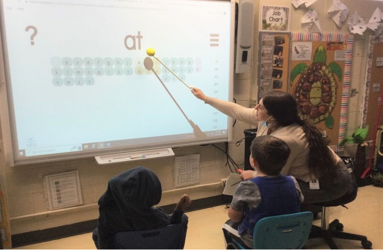 Campbell Children's School students use sound segments to create words on the classroom's SMART Board.