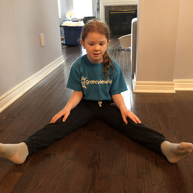 Girl stretching on floor